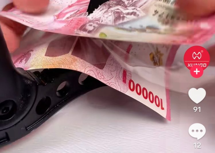 Diduga Rusak Rupiah demi Konten, Akun Xundd Tempredglass Terancam 5 Tahun Penjara
